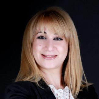 Olga Zakinova Headshot.png